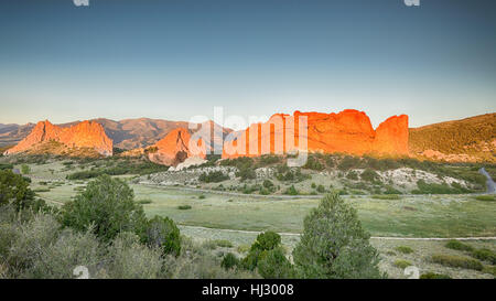 Dawn colors South Gateway, Signature, North Gateway, Kissing Camels, Tower of Babel (named rock formations) in Garden of the Gods, Colorado Springs Stock Photo