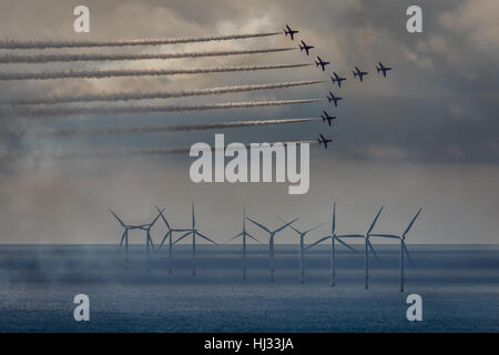 The Red Arrows over the Gwynt y Mor windfarm off the North Wales Coast. Stock Photo