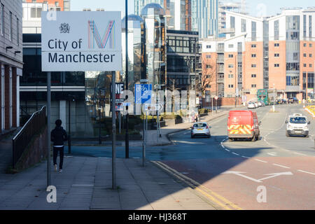 City of Manchester sign on Medlock Street, Manchester City centre with construction site in background. Stock Photo