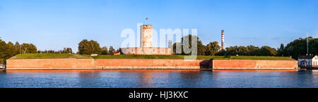 Medieval Wisloujscie Fortress with old lighthouse tower in port of Gdansk, Poland. A unique monument of the fortification works. Stock Photo