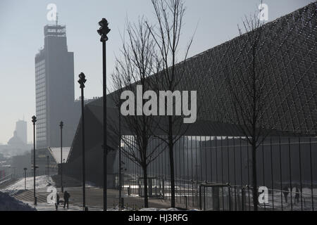 Modern building of  International Conference Centre in Katowice in the background highest building,silhouette cathedral roof Stock Photo