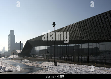 Modern building of  International Conference Centre in Katowice in the background highest building,silhouette cathedral roof Stock Photo