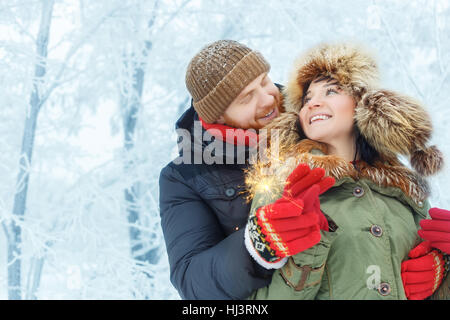 Couple with sparklers outdoors Stock Photo