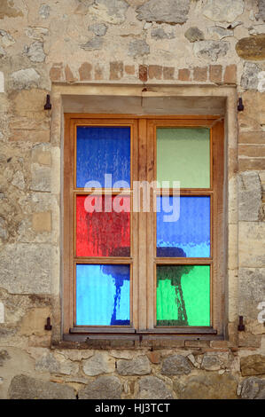 Stained Glass Window or Colored Glass Window in Village House Oppedette Alpes-de-Haute-Provence Provence France Stock Photo