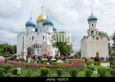 At the Beautiful Cathedral Square in Spring Time. Architectural ensemble of Holy Trinity Sergius Lavra in Sergiyev Posad, Russia Stock Photo