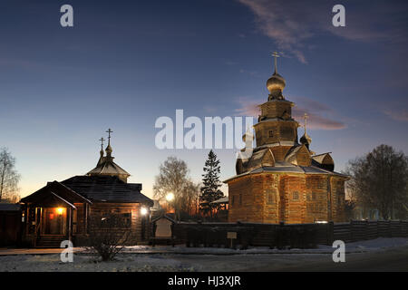 At the Entrance into Museum of Wooden Architecture at Winter Twilight. Suzdal, Russia Stock Photo