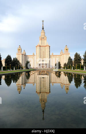 Main Building of Moscow State University (MGU) with Reflection in Water Pool on Early Summer Morning. Moscow, Russia Stock Photo