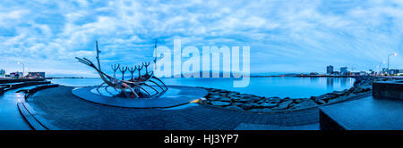 Solfar Sun Voyager metal Viking ship in Reykjavik, Iceland facing the harbor waterfront. Stock Photo