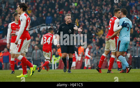 Referee Jon Moss awards Arsenal a penalty after Ben Mee of Burnley fouls Arsenal’s Laurent Koscielny in added time during the Premier League match between Arsenal and Burnley at the Emirates Stadium in London. January 22, 2017. EDITORIAL USE ONLY Stock Photo