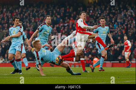 Ben Mee of Burnley fouls Arsenal’s Laurent Koscielny for a penalty in added time during the Premier League match between Arsenal and Burnley at the Emirates Stadium in London. January 22, 2017.  EDITORIAL USE ONLY Stock Photo