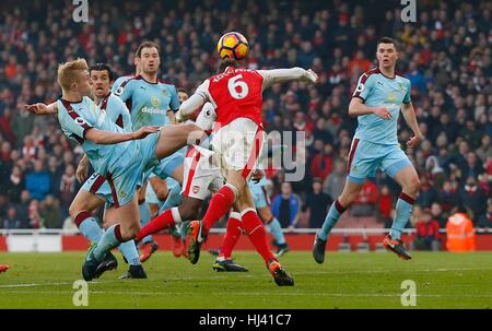 Ben Mee of Burnley fouls Arsenal’s Laurent Koscielny for a penalty in added time during the Premier League match between Arsenal and Burnley at the Emirates Stadium in London. January 22, 2017.  EDITORIAL USE ONLY Stock Photo