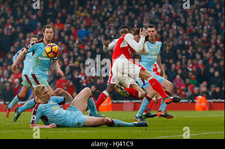 Ben Mee of Burnley fouls Arsenal’s Laurent Koscielny for a penalty in added time during the Premier League match between Arsenal and Burnley at the Emirates Stadium in London. January 22, 2017.  EDITORIAL USE ONLY Stock Photo