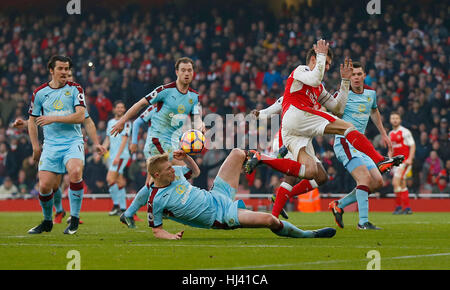 Ben Mee of Burnley fouls Arsenal’s Laurent Koscielny for a penalty in added time during the Premier League match between Arsenal and Burnley at the Emirates Stadium in London. January 22, 2017.  EDITORIAL USE ONLY Stock Photo