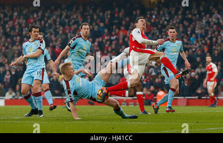 Ben Mee of Burnley fouls Arsenal’s Laurent Koscielny for a penalty in added time during the Premier League match between Arsenal and Burnley at the Emirates Stadium in London. January 22, 2017.  EDITORIAL USE ONLY Stock Photo