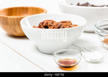 Pecan Nuts In White Bowl On Table Stock Photo