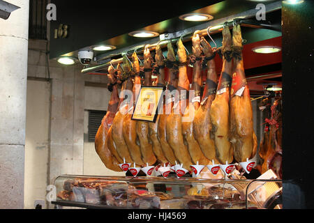 Row of Serrano hams displayed in a market Stock Photo