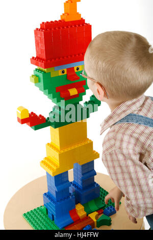 Little boy playing with bricks Stock Photo