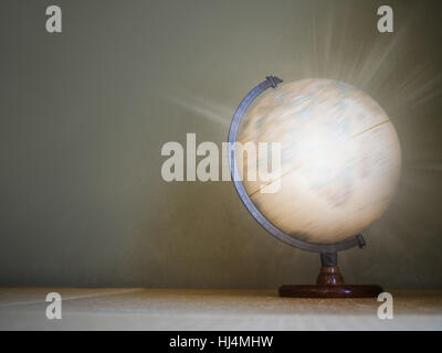 Light effect on spinning globe model Stock Photo