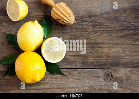 Fresh organic lemons on rustic wooden background with copy space Stock Photo