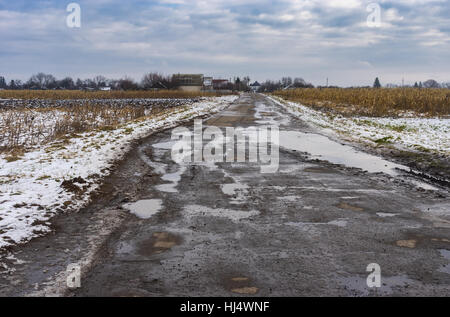 Rural landscape road leading to Trinity Temple in Ukrainian village Velyki Budischa, Poltavskaya oblast, Ukraine Stock Photo