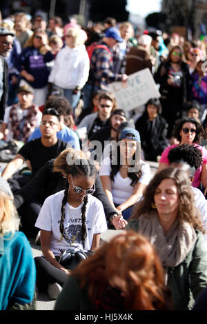 Los Angeles, California, USA. 21st January, 2017. Protesters take a moment to meditate on the corner of 5th and Hill Street during the Women's March in Los Angeles, California. Credit: Daniel Dreifuss/Alamy Live News Stock Photo