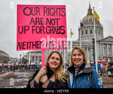 San Francisco, California, USA. 21st January, 2017. Two women hold sign in front of San Francisco Cit Hall that, 'Our rights are not up for grabs. Neither are we,' before San Francisco Women's March 2017. Credit: Shelly Rivoli/Alamy Live News Stock Photo