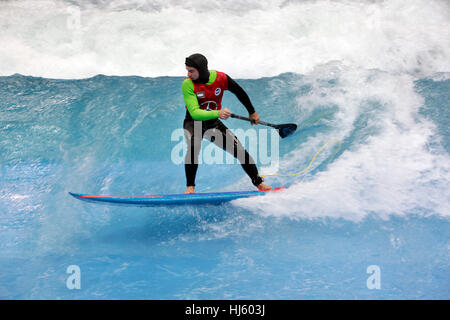 Dusseldorf, Germany. 20th January, 2017. boot Duesseldorf 2017 - the worlds biggest yachting and water sports exhibition.The Wave is new at the fair and a standing wave 9 meter wide. Stand-Up-Padler Hannes shows his skills. Stock Photo