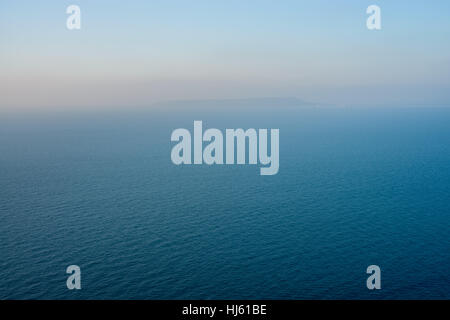 View from White Nothe, Dorset, UK. A colourful winter sunrise looking towards Portland from high up on the white chalk cliffs of White Nothe in Dorset. © Dan Tucker/Alamy Live News Stock Photo