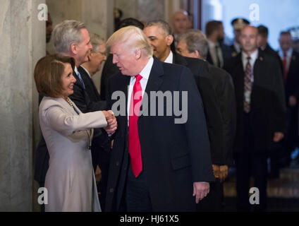 Washington, Us. 20th Jan, 2017. United States President-elect Donald Trump greets US House Minority Leader Nancy Pelosi (Democrat of California), and other Congressional leaders as he arrives for his inauguration ceremony on Capitol Hill in Washington, Friday, Jan. 20, 2017. Credit: J. Scott Applewhite/Pool via CNP - NO WIRE SERVICE - Photo: J. Scott Applewhite/Consolidated/Pool/dpa/Alamy Live News Stock Photo