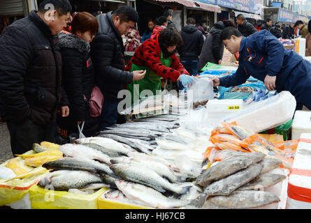 Liaocheng, China's Shandong Province. 26th Jan, 2017. People purchase goods for the upcoming Spring Festival in Liaocheng, east China's Shandong Province, Jan. 26, 2017. The traditional Chinese Spring Festival falls on Jan. 28 this year. Credit: Kong Xiaozheng/Xinhua/Alamy Live News Stock Photo