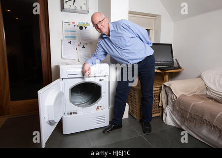 Owner of a Hotpoint tumble dryer manufactured by Whirlpool waits for replacement of unit believed to be affected by a fault which causes fire, England Stock Photo