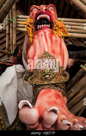 Frightening and scary Ogoh-Ogoh statue in the process of being prepared for the Balinese Hindu parade on the Eve of the Balinese New Year Stock Photo