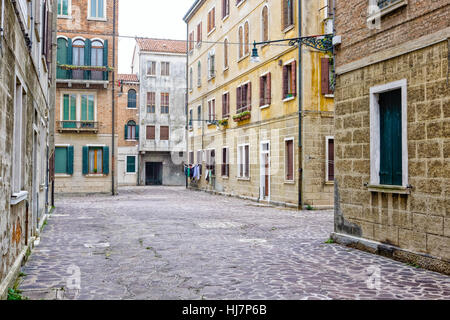 Clothes hung out to dry in Venice, out of an old building Stock Photo