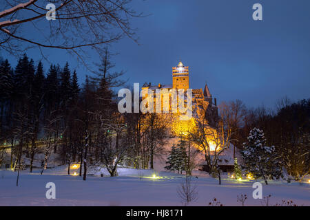 Winter view of Bran castle, also known as Dracula's castle, at blue hour Stock Photo