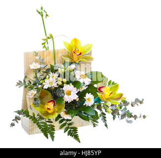 Bright flower bouquet in basket isolated over white background Stock Photo