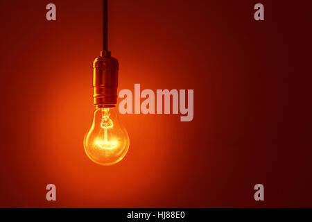 light bulb on red background Stock Photo