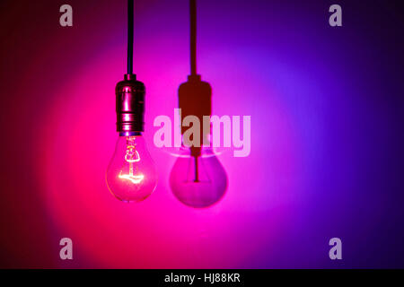 light bulb on red background Stock Photo