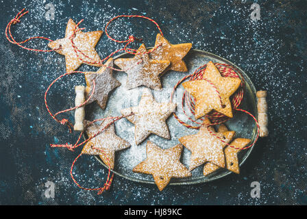 Christmas star shaped gingerbread cookies for tree decoration with ropes Stock Photo