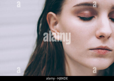 Close-up portrait of a woman with eyes closed Stock Photo