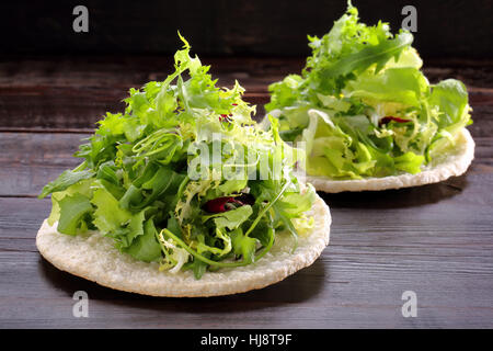 Fresh green salad mix on rice waffle Stock Photo
