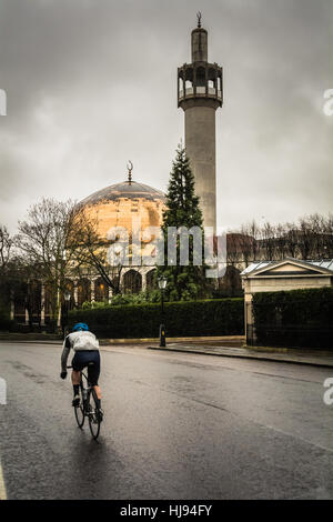 A cyclist passes in front of The London Central Mosque in Regent's Park, London, England, UK Stock Photo