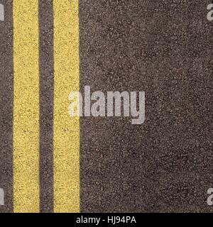 Detail of solid double yellow line in road crossing metal strips in ...