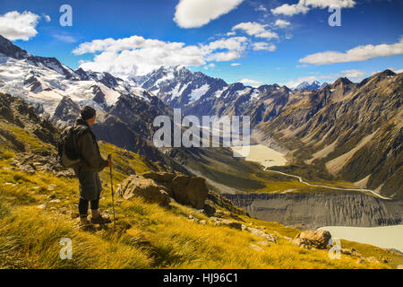 Isolated Hiker Profile Scenic Landscape View Mueller Hut Track Hike Mount Cook National Park Skyline New Zealand Southern Alps Mountains Sunny Day Stock Photo