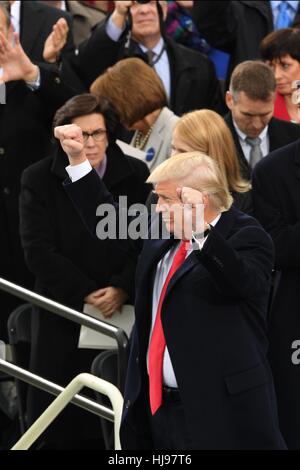President Donald Trump holds his fists in victory following his Inaugural address after being sworn-in as the 45th President on Capitol Hill January 20, 2017 in Washington, DC. Stock Photo
