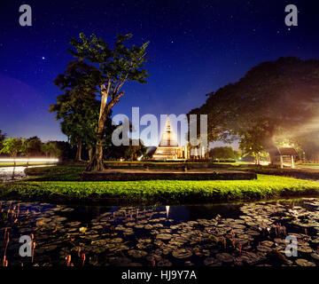 Light show in Golden Stupa Buddhist Temple in Sukhothai Historical Park, Thailand Stock Photo