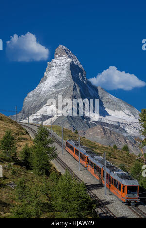 Gornergratbahn passenger train under Matterhorn, Zermatt, Canton Wallis, Switzerland Stock Photo