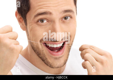 Man flossing his teeth isolated on white background Stock Photo