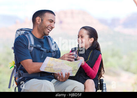 Hiking girl and young man looking at map, Sedona, Arizona, USA Stock Photo