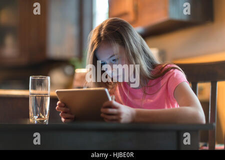 Girl using digital tablet Stock Photo
