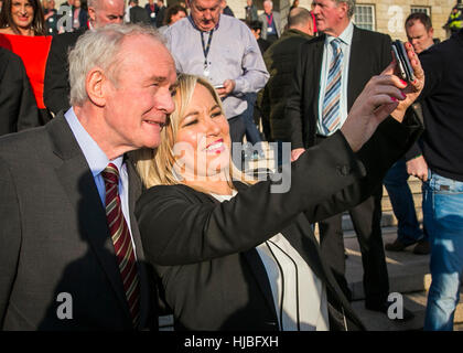 Newly appointed Sinn Fein leader for Stormont Michelle O'Neill taking a selfie with former leader Martin McGuiness on the steps on Stormont Buildings. Stock Photo